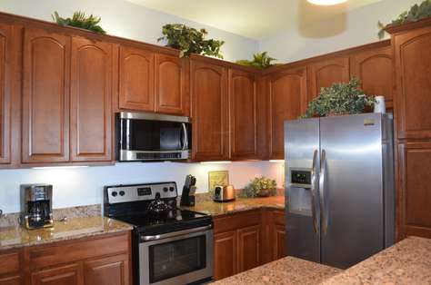 Fully equipped kitchen with stainless steel appliances, coffee maker, toaster, etc.