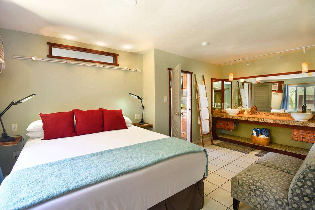 OCEAN BREEZE SUITE bedroom King bed & wall to wall vanity.