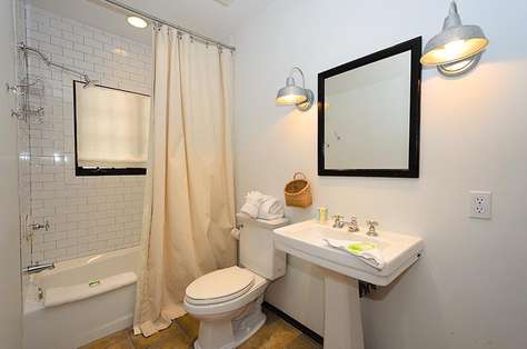 Private bath off bunk room with shower/tub combination