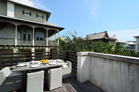 Sunny, upstairs terrace which also functions as an outdoor dining room and grilling area