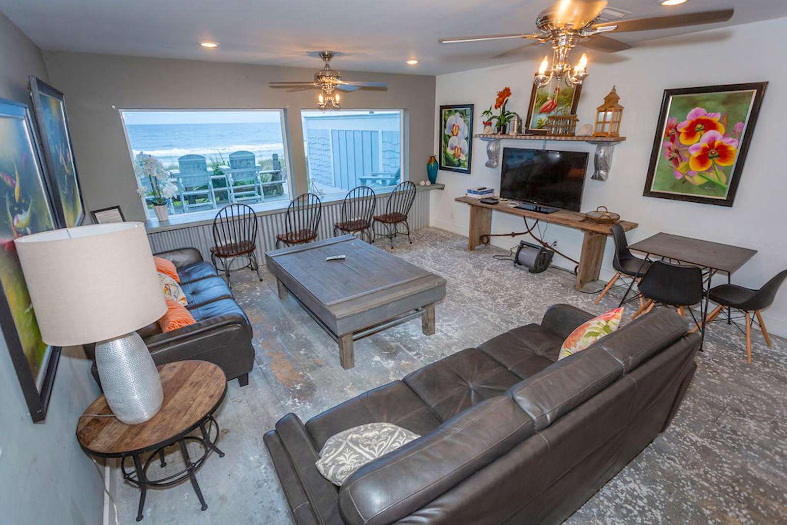 family room with 2 large sofas, flat screen, bar table with 4 chairs, card table with 4 chairs,
