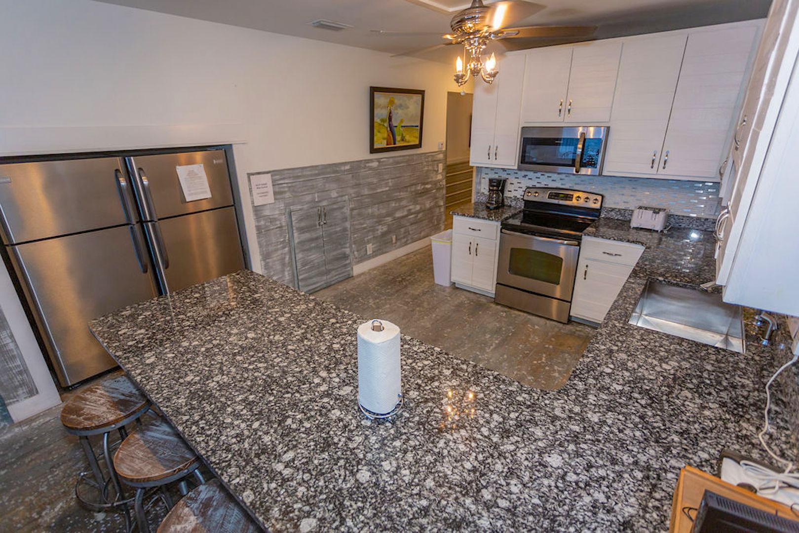 Fully stocked kitchen with 2 large refrigerators