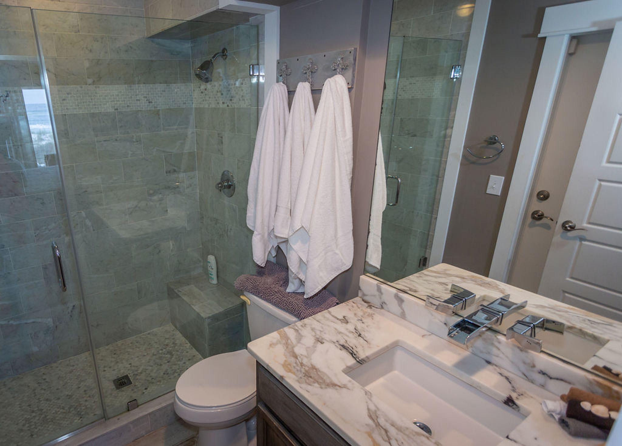 Bathroom #1 - large white Carrera marble shower with built-in bench