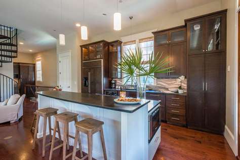 Gourmet Kitchen with Extra Large Refrigerator and Seating Space for 3 at Small Table at End of Island