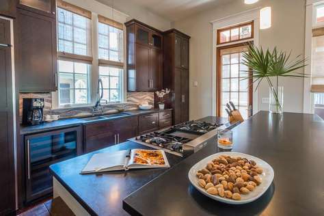 Gourmet Kitchen with Extra Large Refrigerator and Seating Space for 3 at Small Table at End of Island