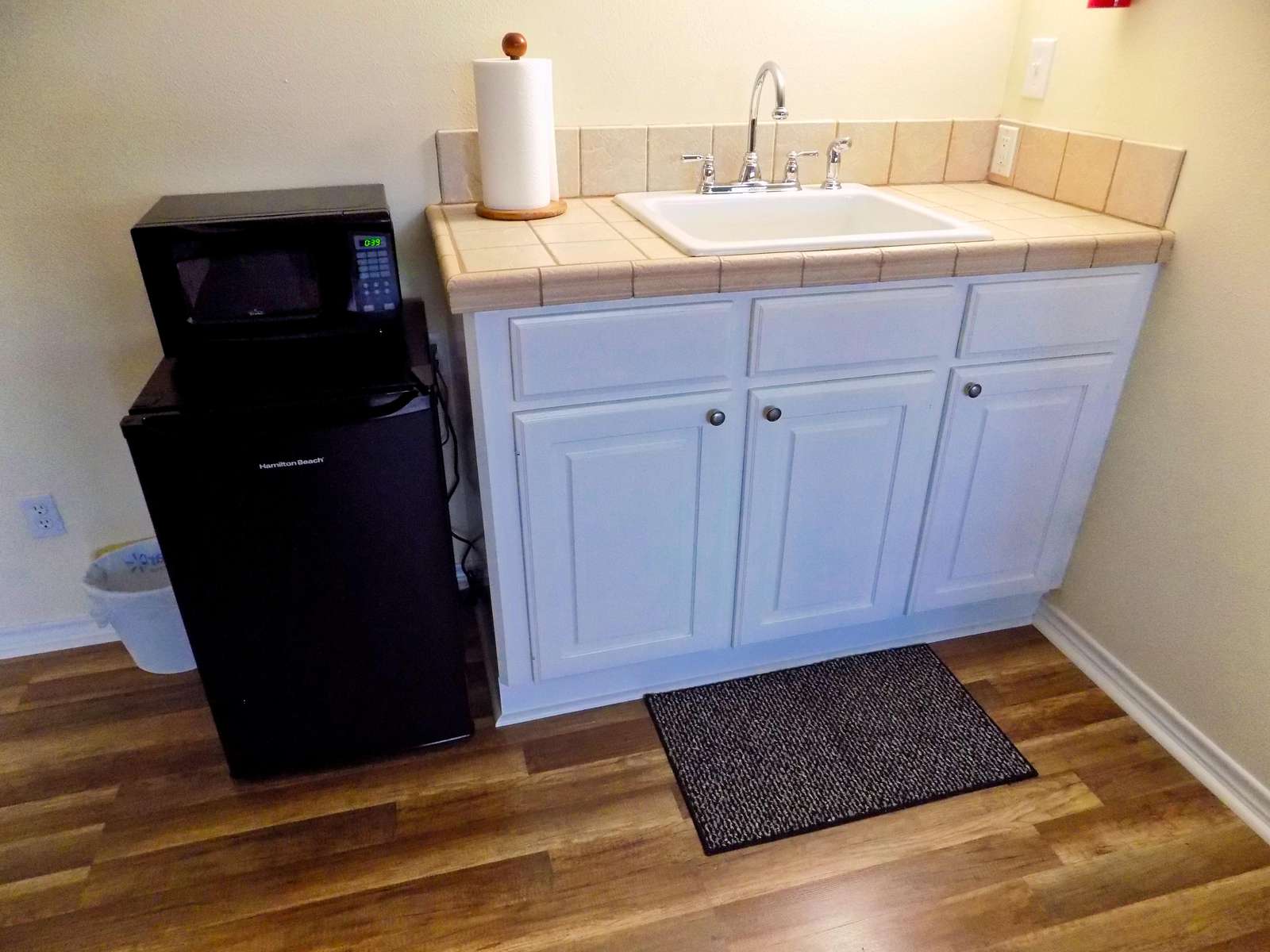 The gameroom has a spot for snacks and drinks.