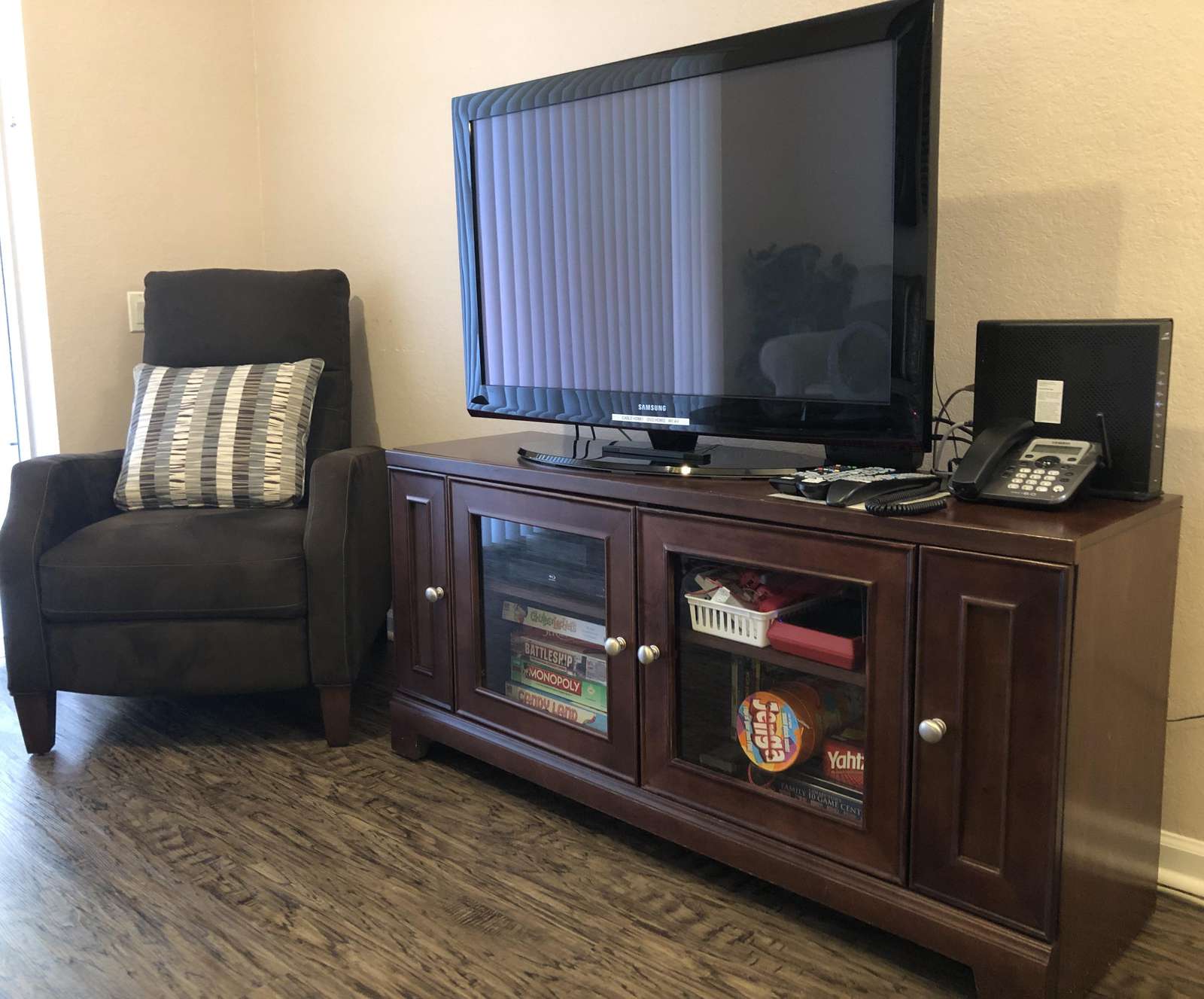Large TV, DVD player, Wii console, games, and much more