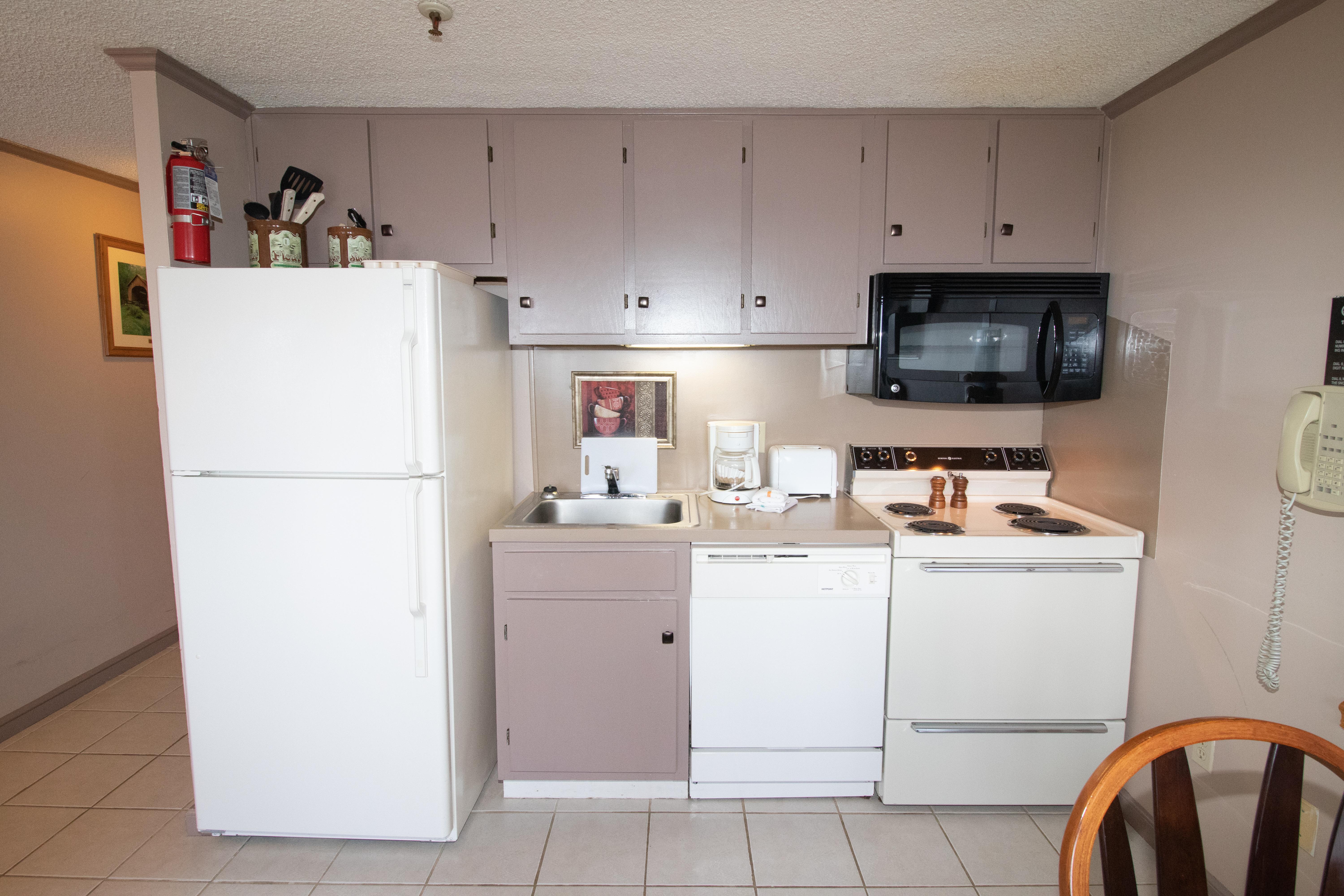 Fully-equipped kitchen includes pots, pans & utensils