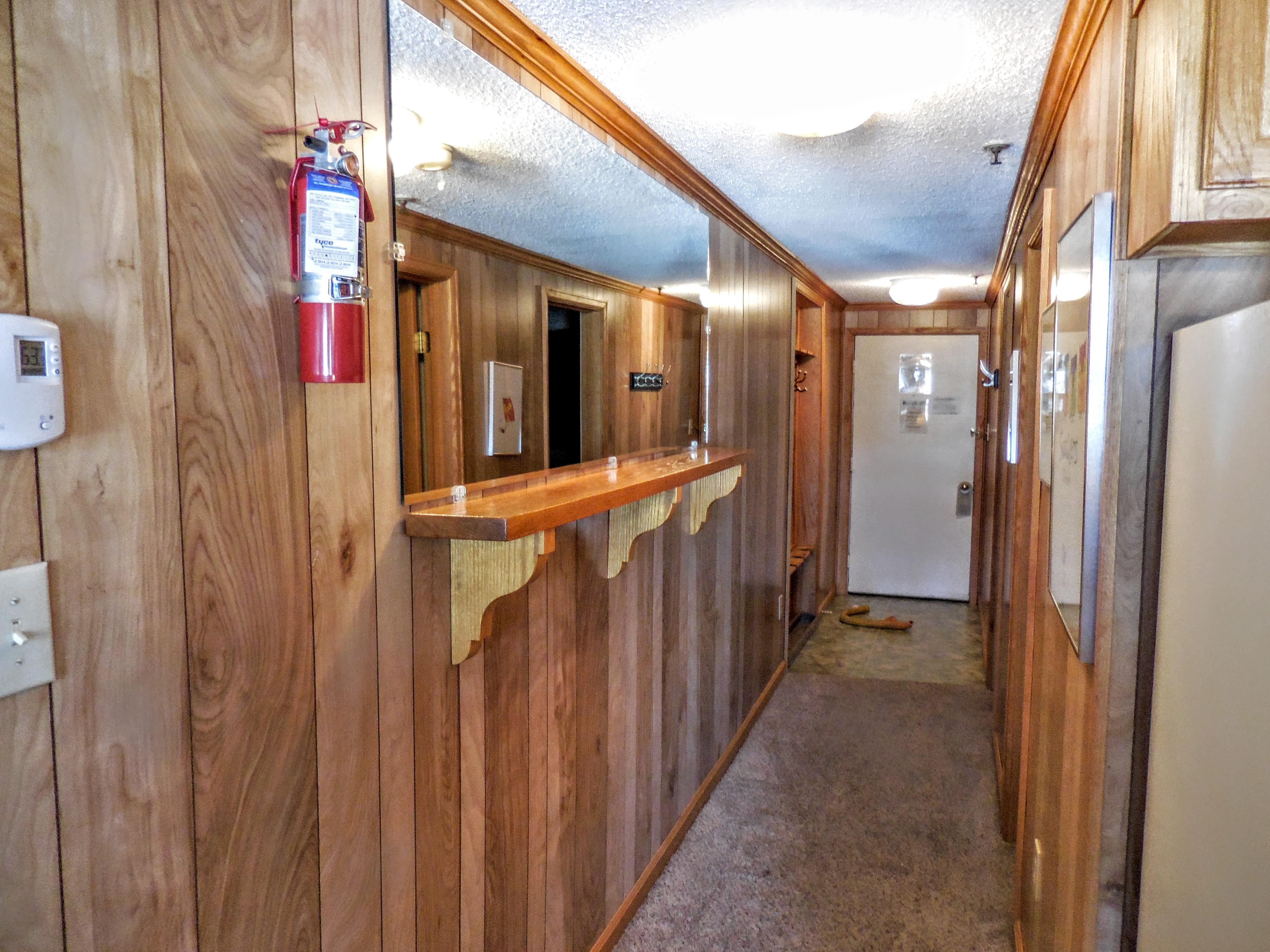 Oak paneling throughout living area and hallway