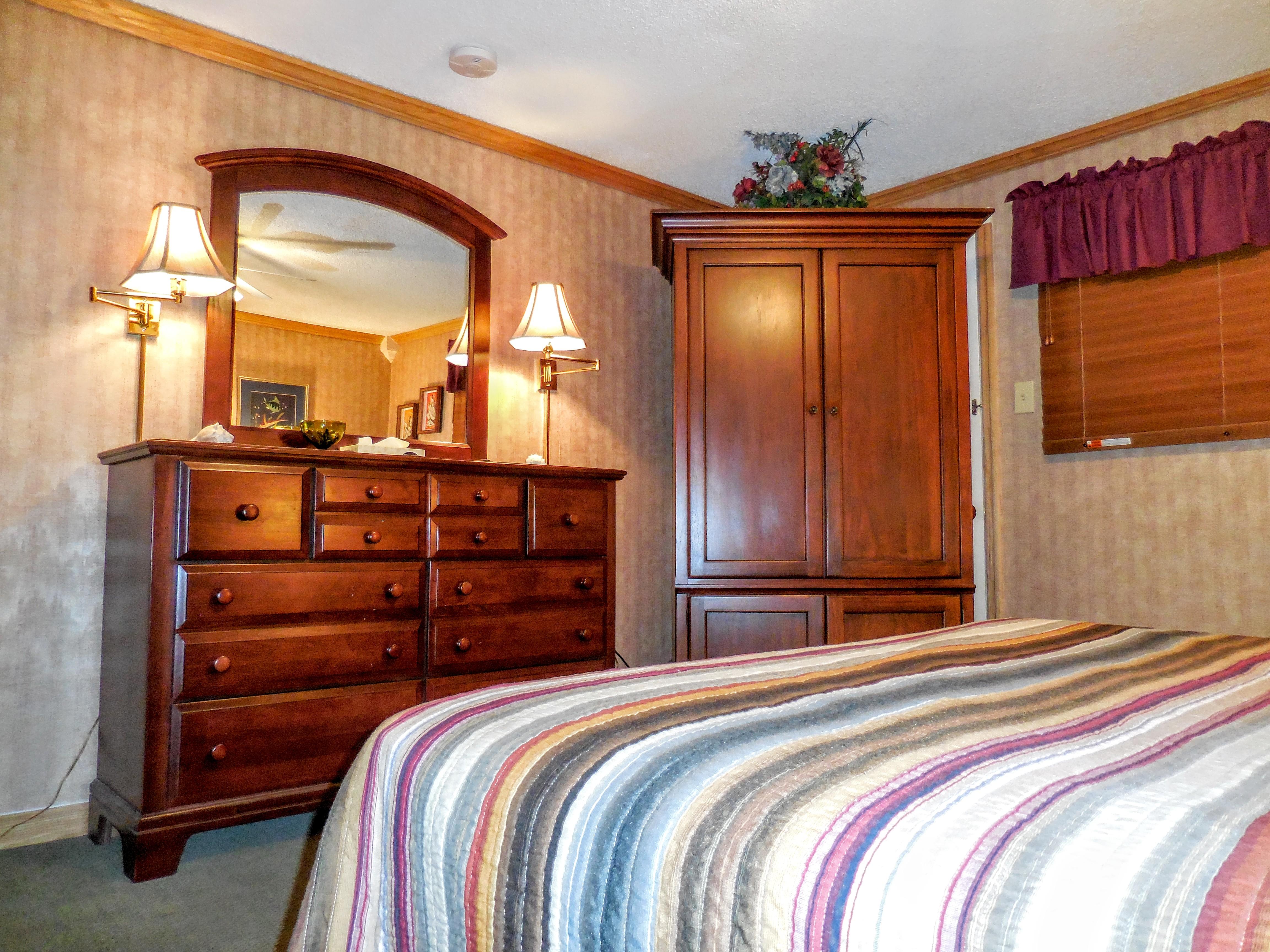 Plenty of storage in master bedroom (armoire and dresser)