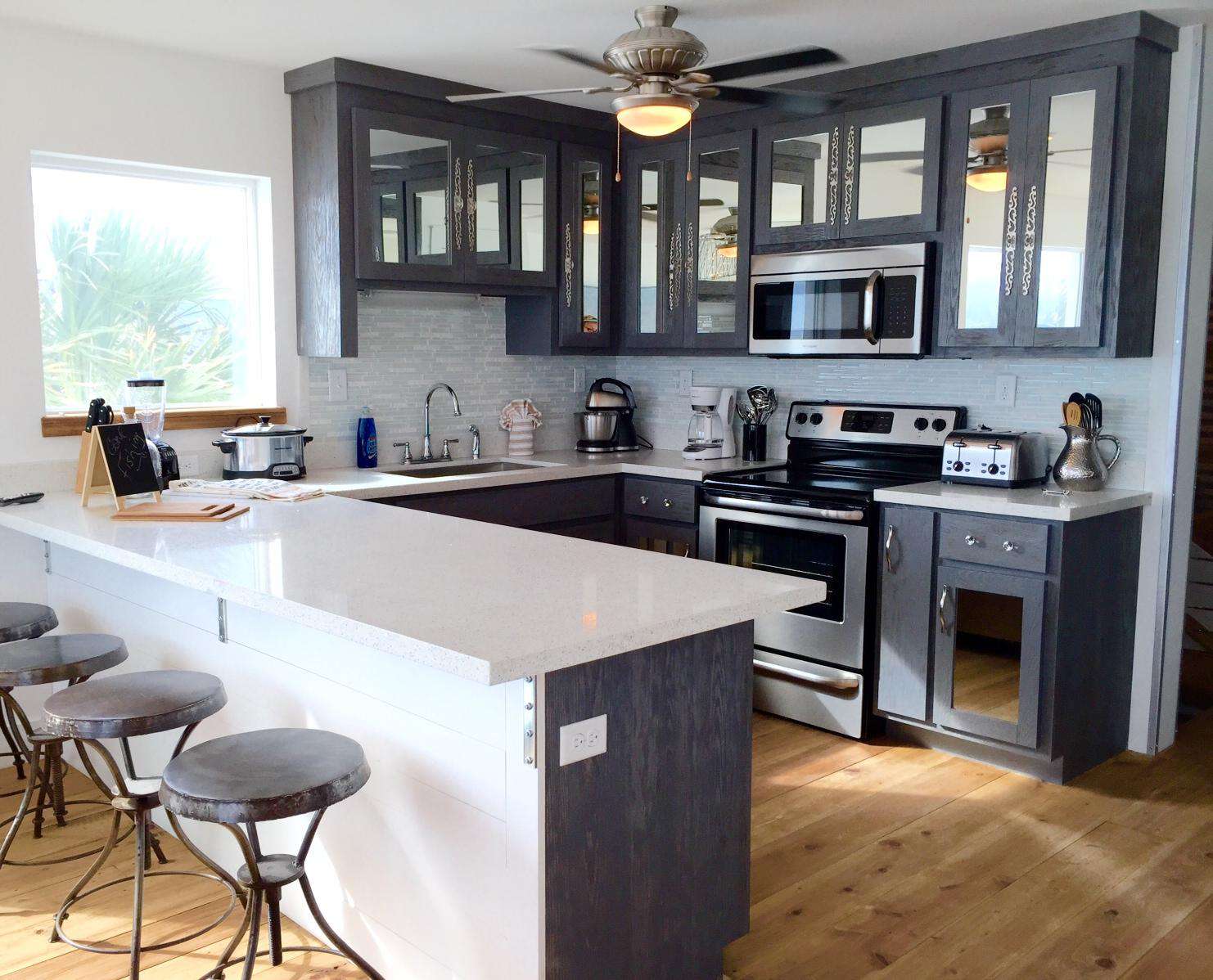 large kitchen , white quartz, 2 side by side refrigerators