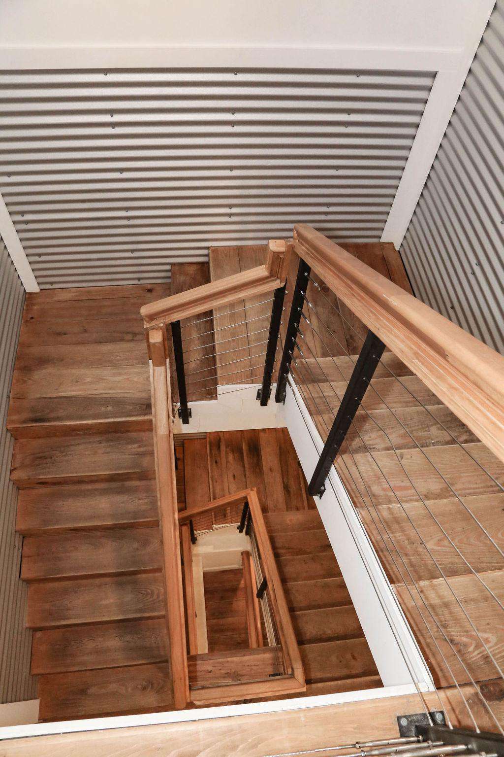 Stainless steel stairwell with hand rubbed cypress flooring