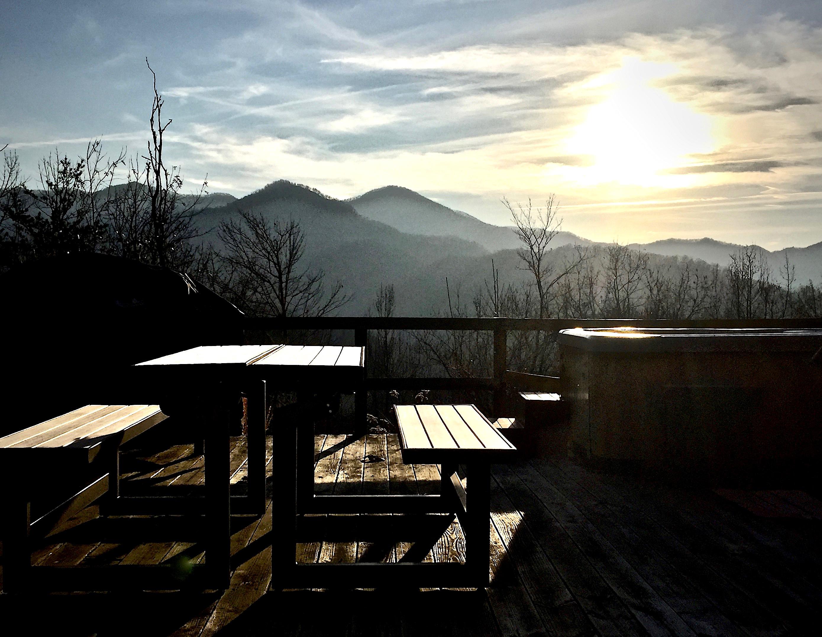 Near the Fire Pit, there is a PicNic Table (converts to Benches)