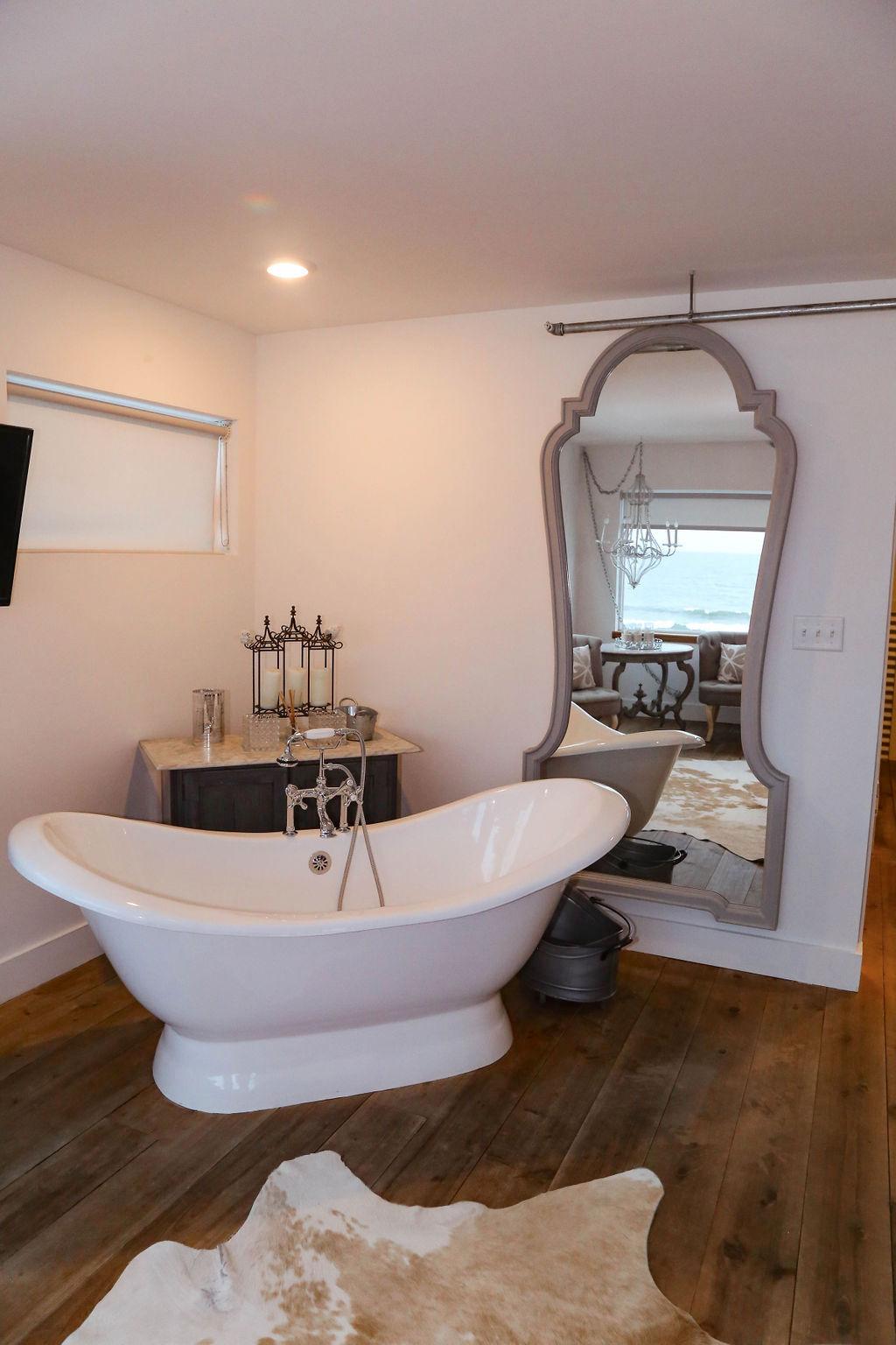 Bedroom # 4 large slipper tub with chandelier --overlooking ocean