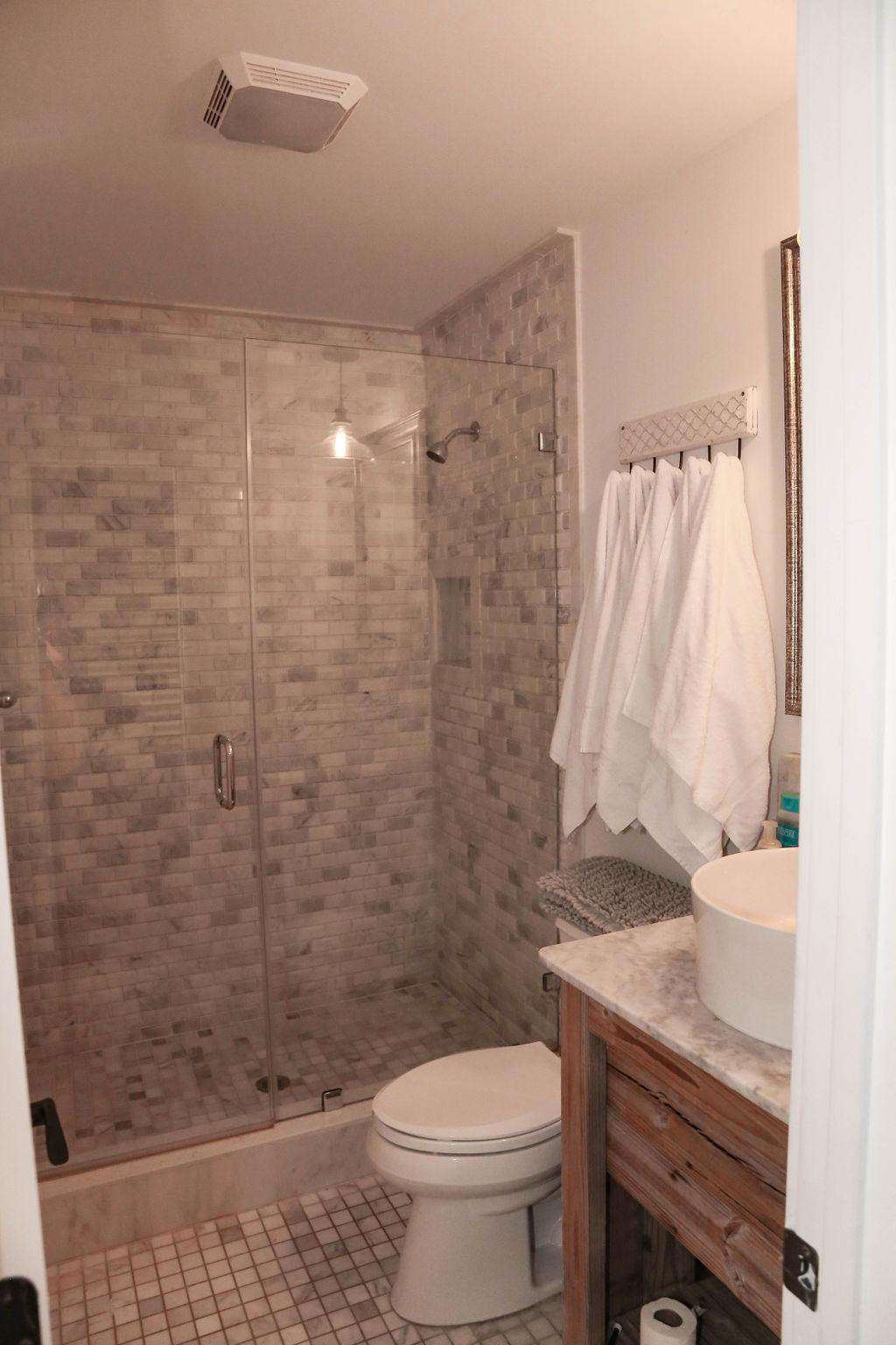 Br # 1 bathroom, white marble shower, glass doors