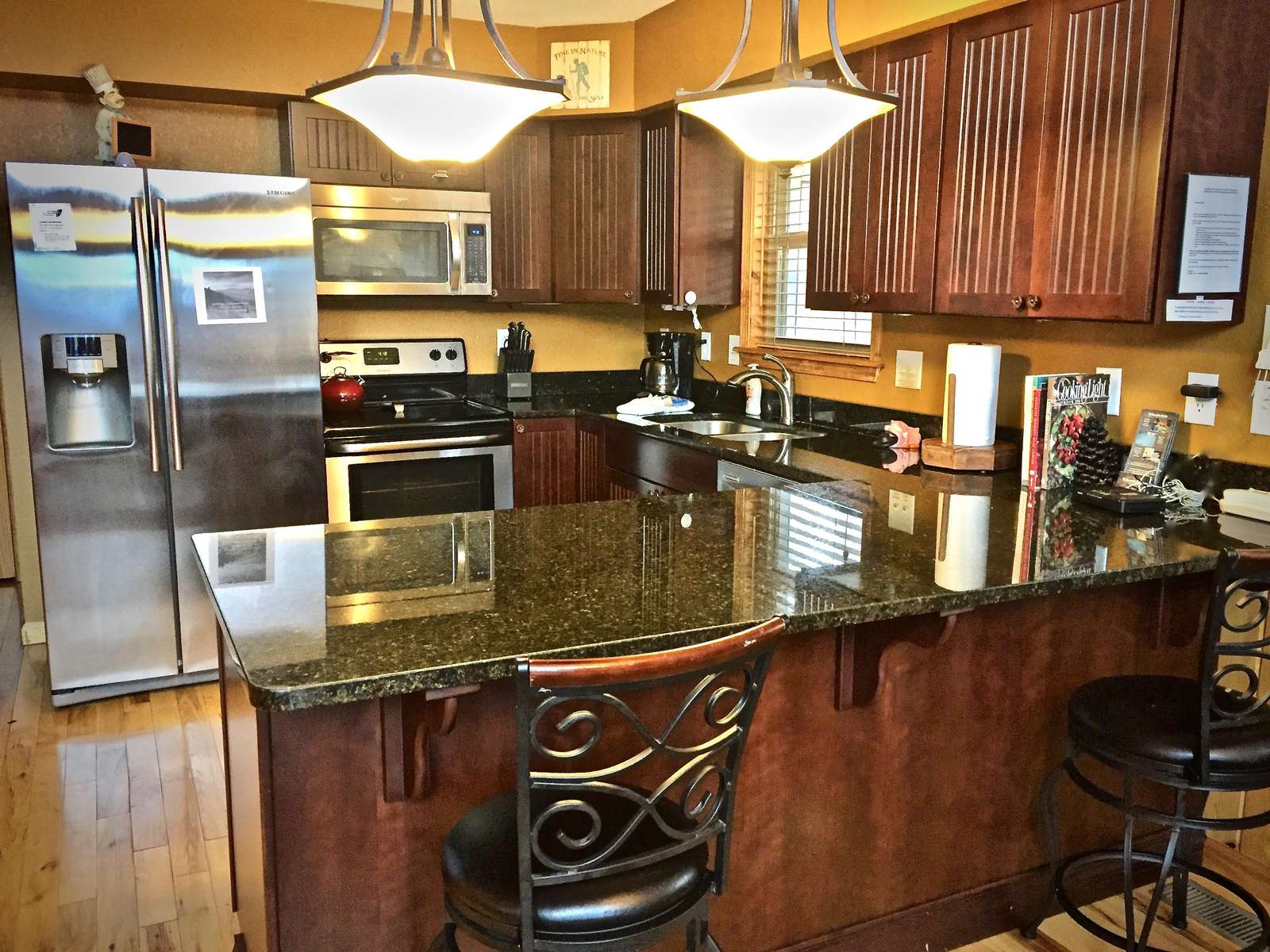 Open concept floor plan, and soaring ceilings offer a light and bright feeling