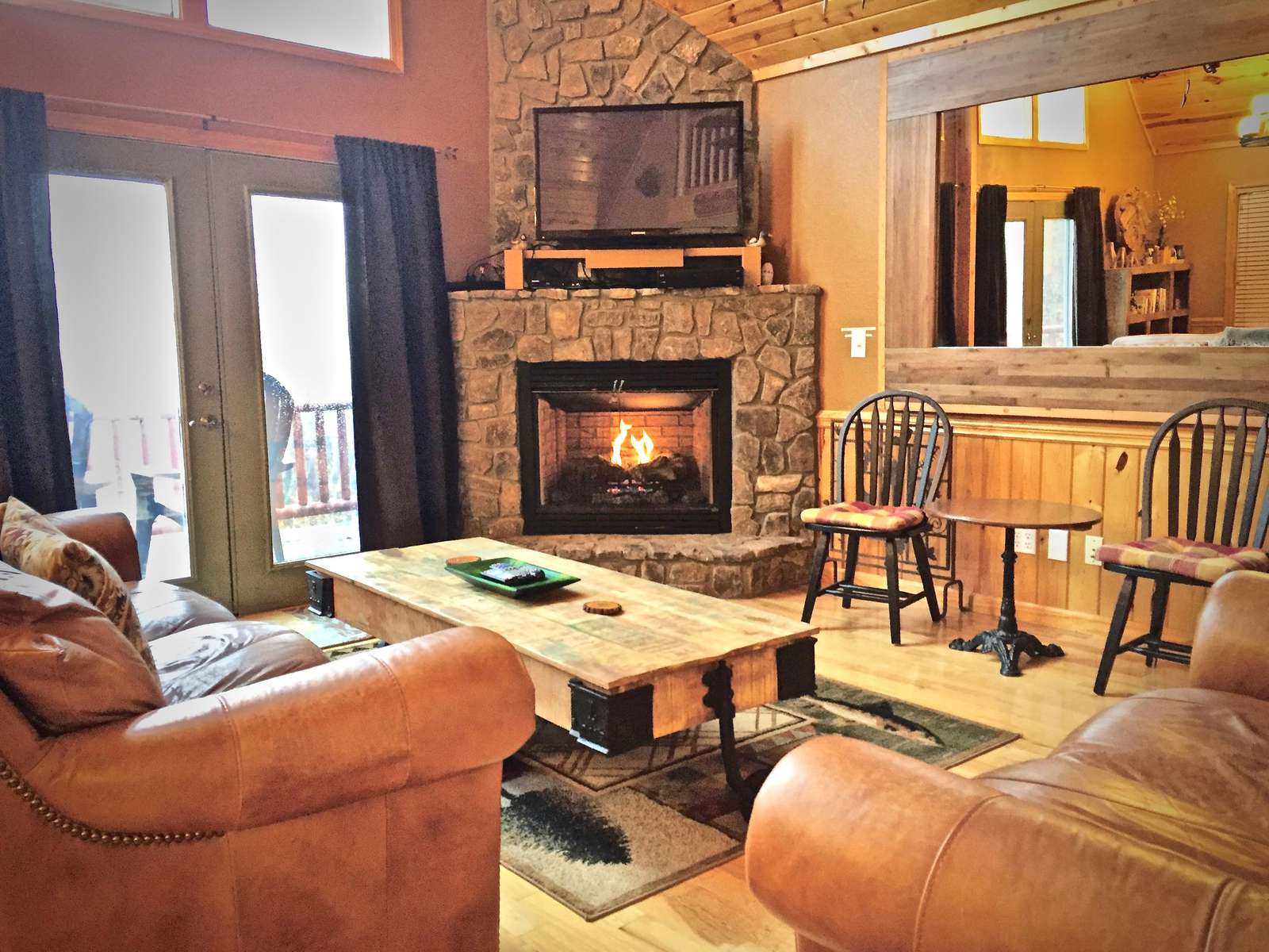 Main level Living Room is Cozy, and is ideal for gathering and entertaining