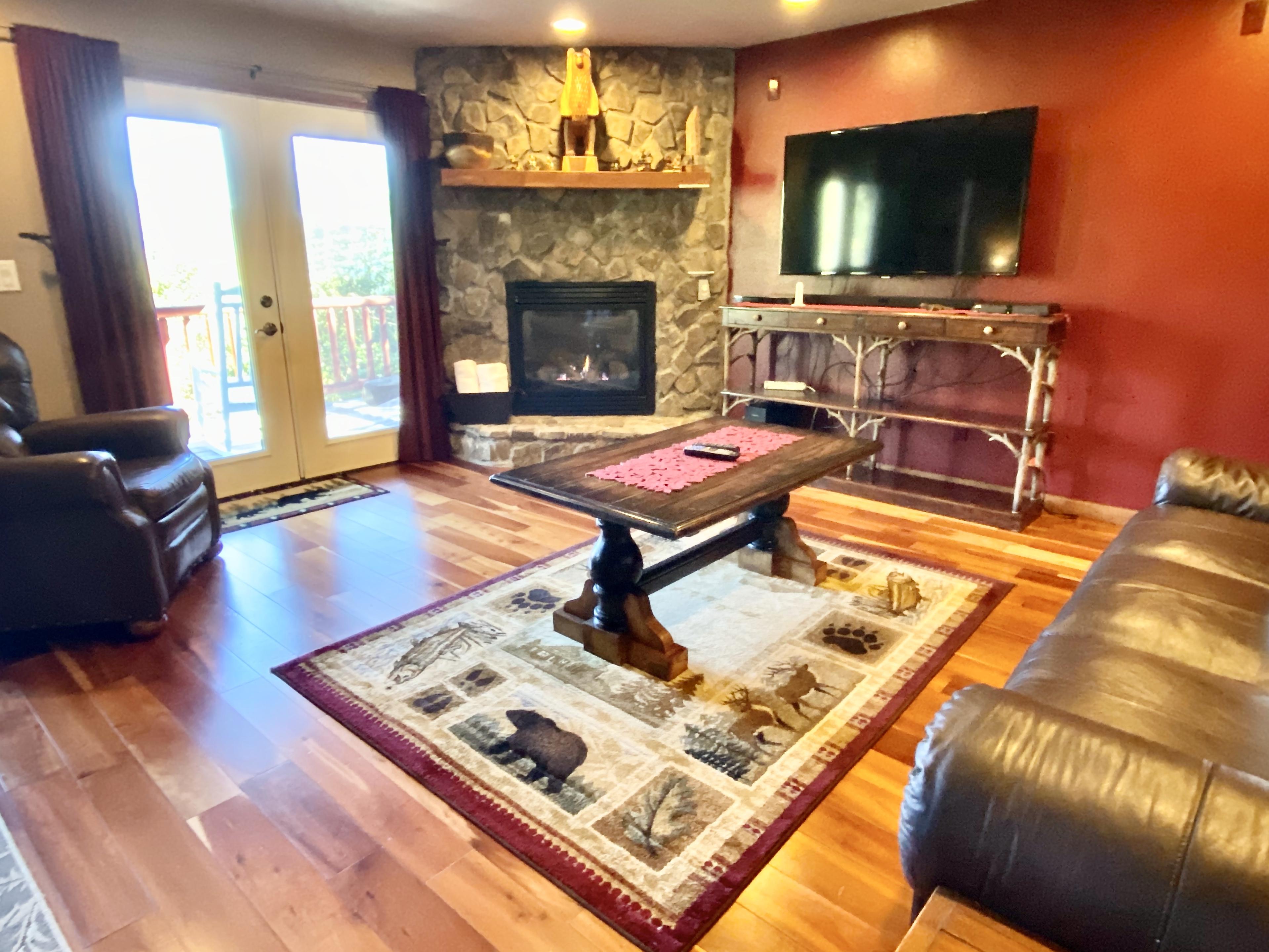 The Master Suite Offers a Luxurious King Bed, 2nd Fireplace, Private Living Room with 55" Flat Screen TV and French Doors leading to the Hot Tub Deck...