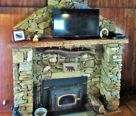 Massive Native Stone Fireplace with Wood Stove Inset