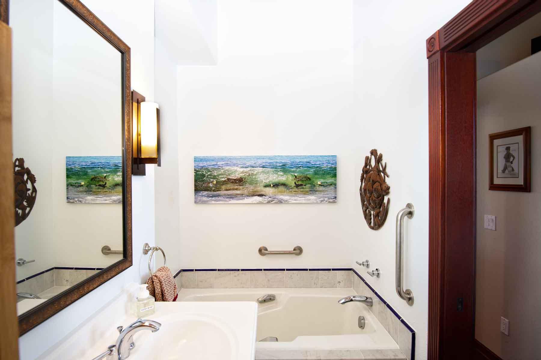 Right view of bathroom with deep soaking tub.