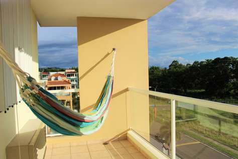 Balcony with hammock overlooking the beach