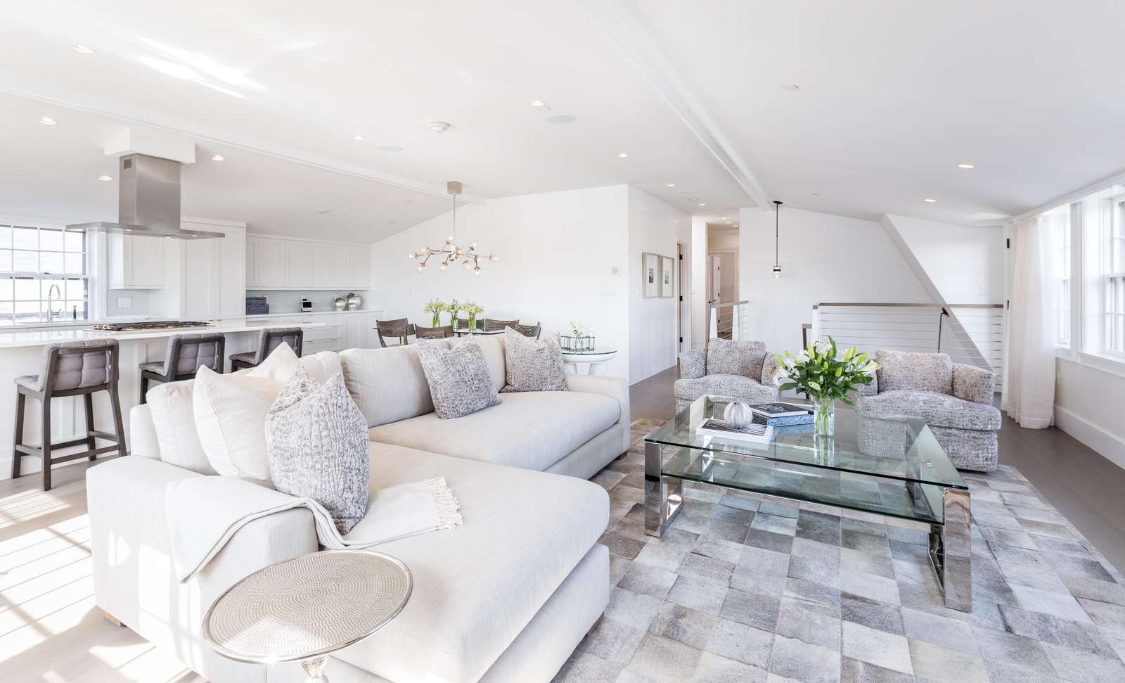 Living room with view of staircase entrance and main hallway