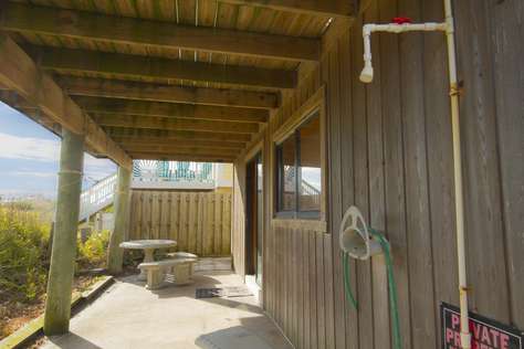 Covered downstairs patio / outside shower.