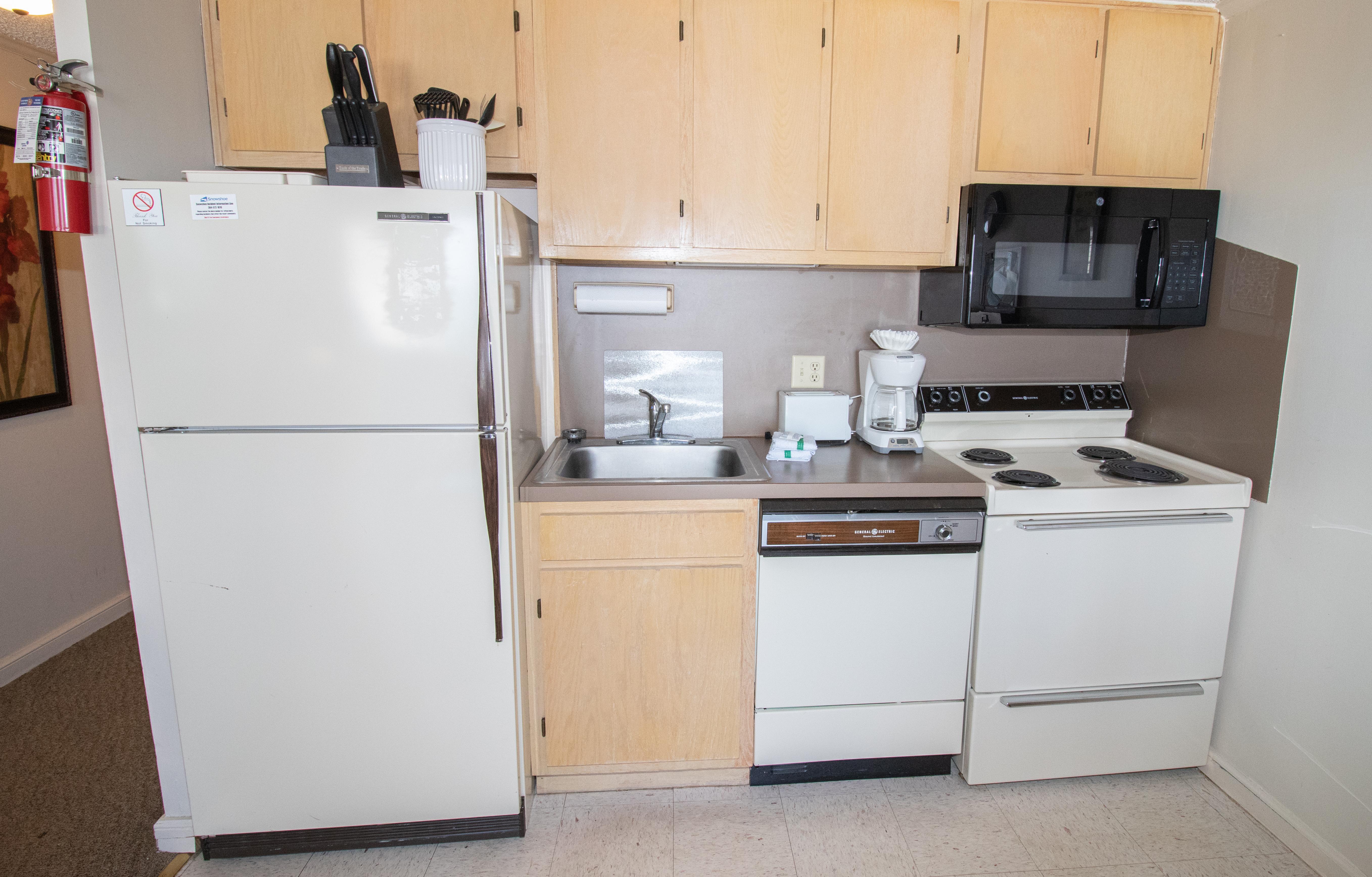 Fully-equipped kitchen includes pots, pans and utensils