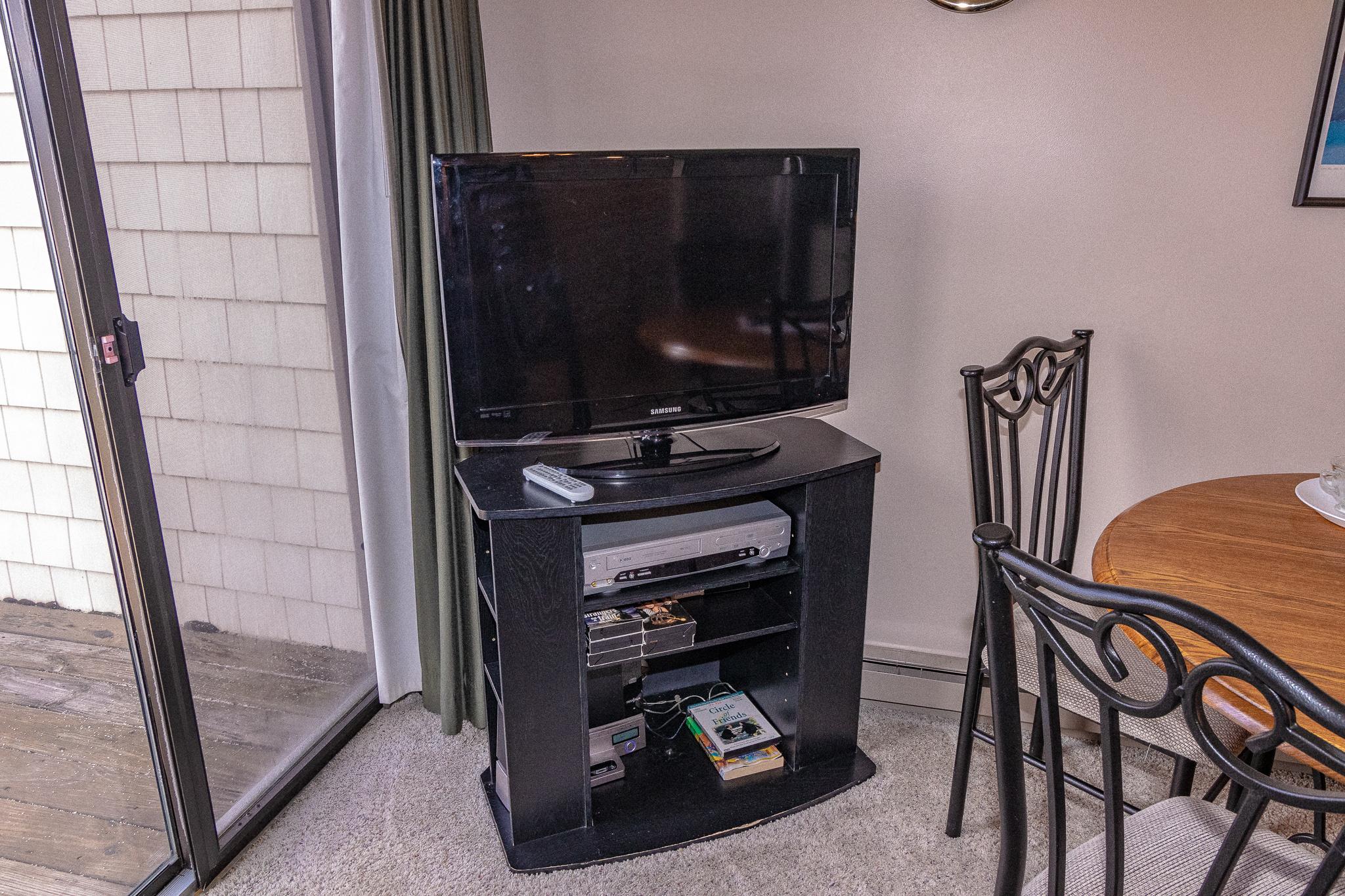 Flat-screen TV with DISHTv, HD channels, HBO and and DVD player.