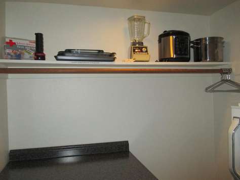 The walk in closet with additional kitchen amenities.