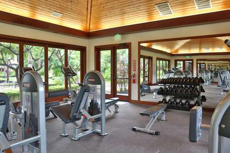 Community gym includes machines and free weights