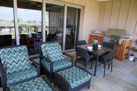 Lanai equipped with furniture, dining area and BBQ area.