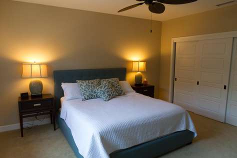 Upstairs bedroom with ensuite bathroom and TV