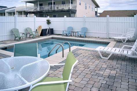 Private pool and deck area in fenced-in backyard
