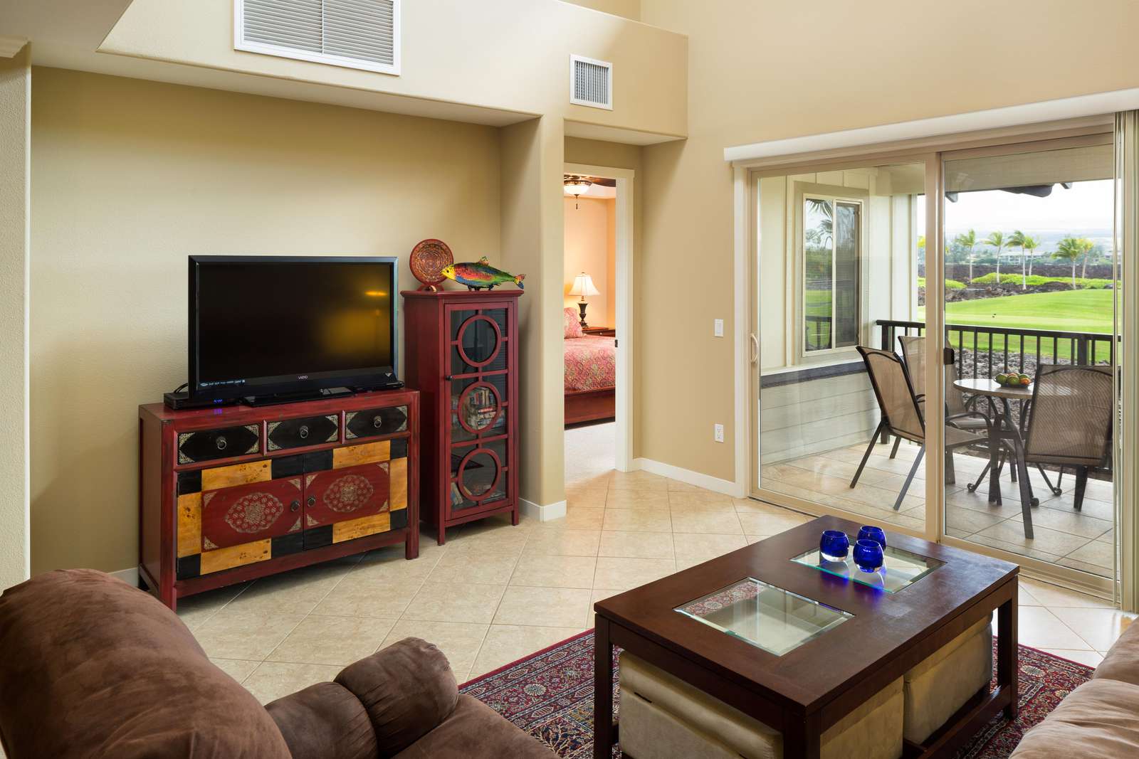Open floor plan, large living room, with high ceilings opens up onto the lanai