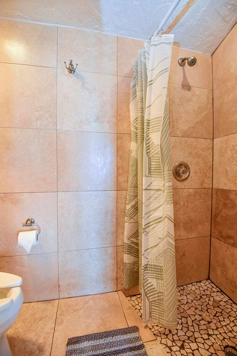 Shower with Travertine stone walls