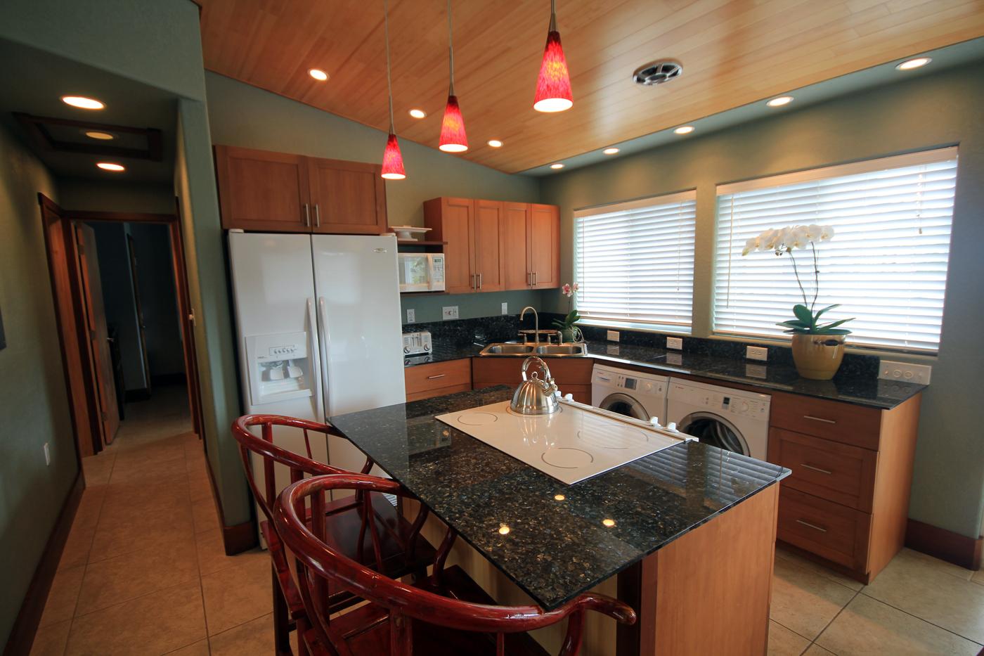 Spaciousl kitchen area with washer and dryer of BAMBOO HA-LE'