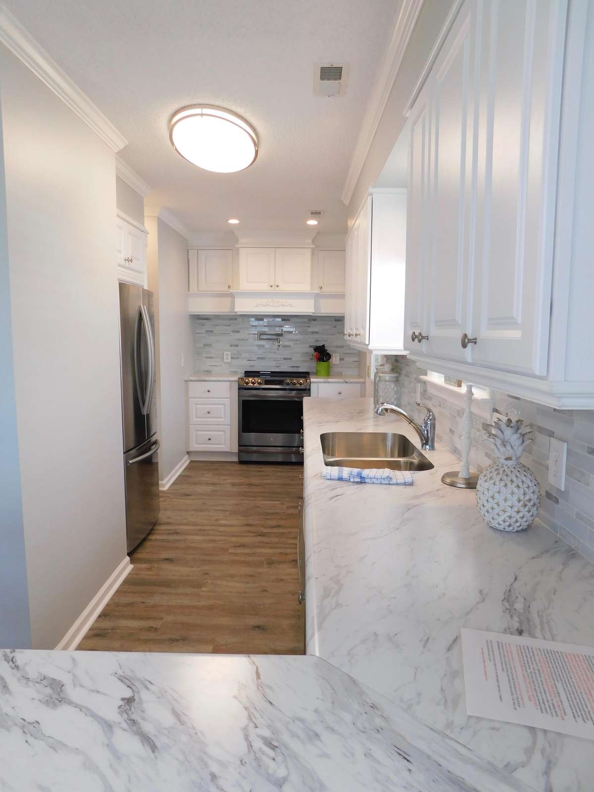 Looking into the kitchen oven on back wall