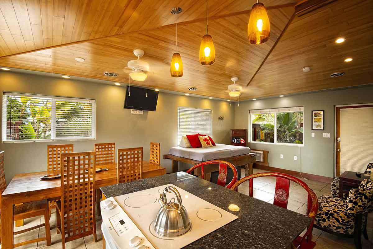 Full kitchen, dining area, full size daybed in den area..