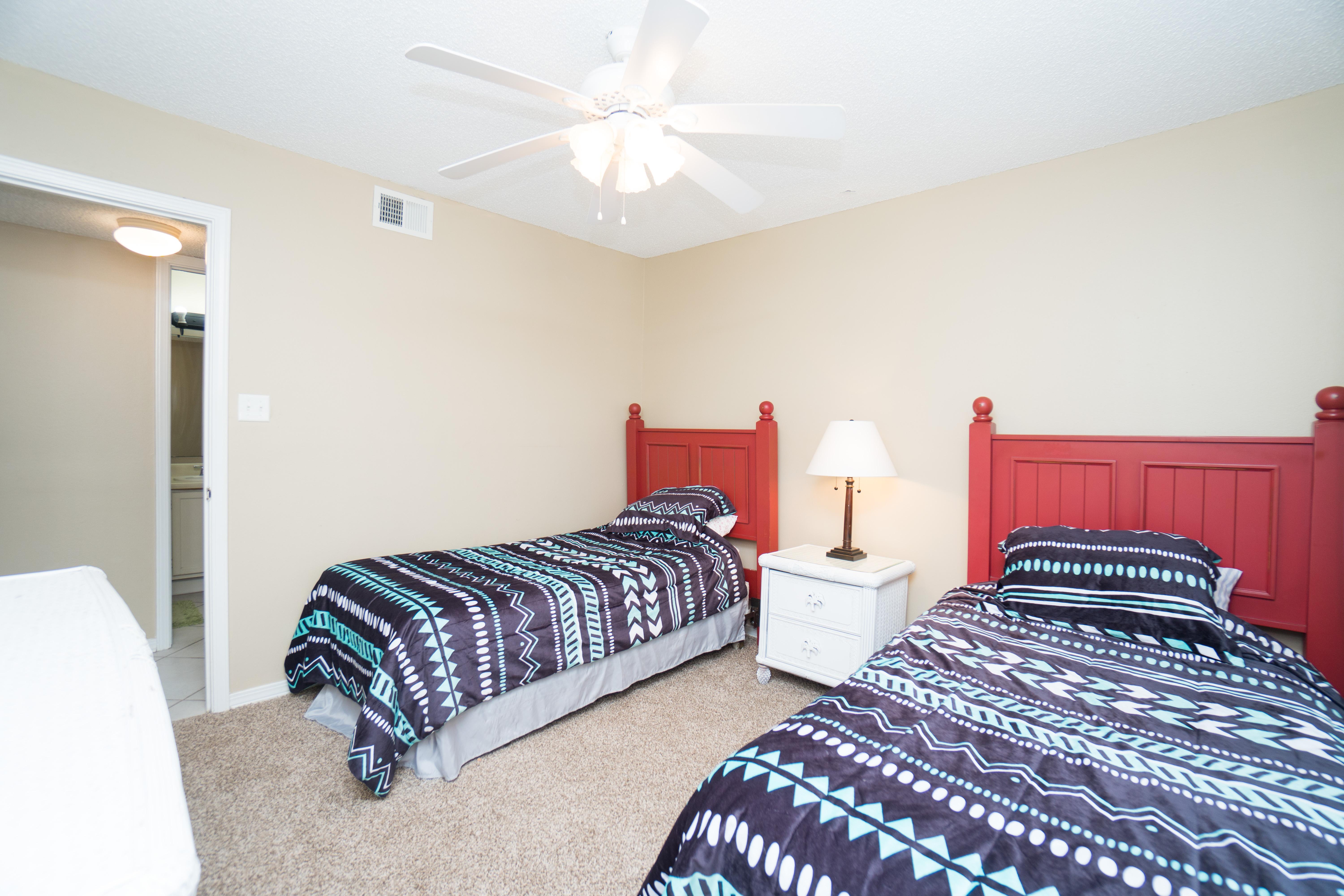 Spacious twin beds in the third bedroom
