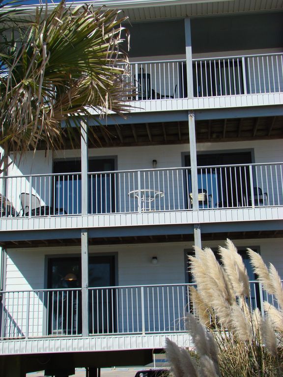 Close-up - Second floor double balcony overlooking beach and gulf.