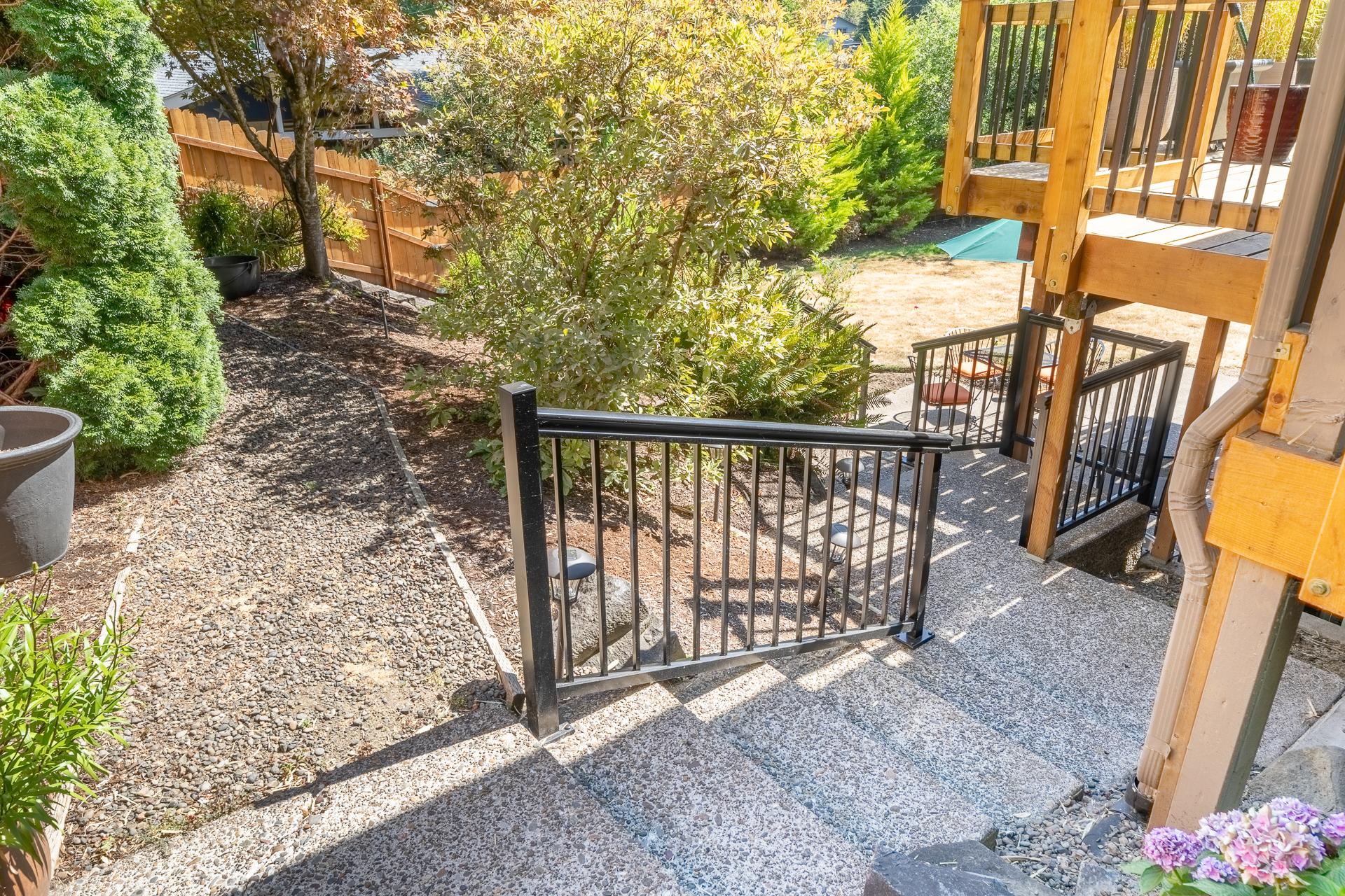 Stair with railing down to the Flat entrance