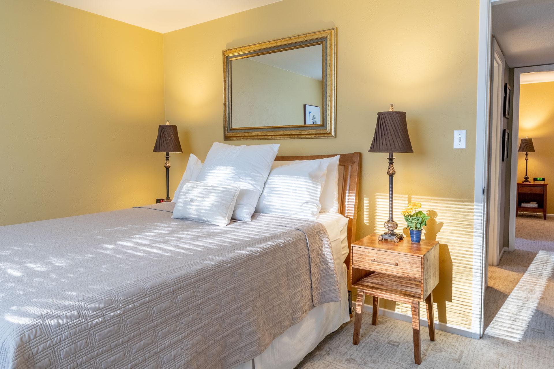 Two separate guest rooms that share a full bathroom