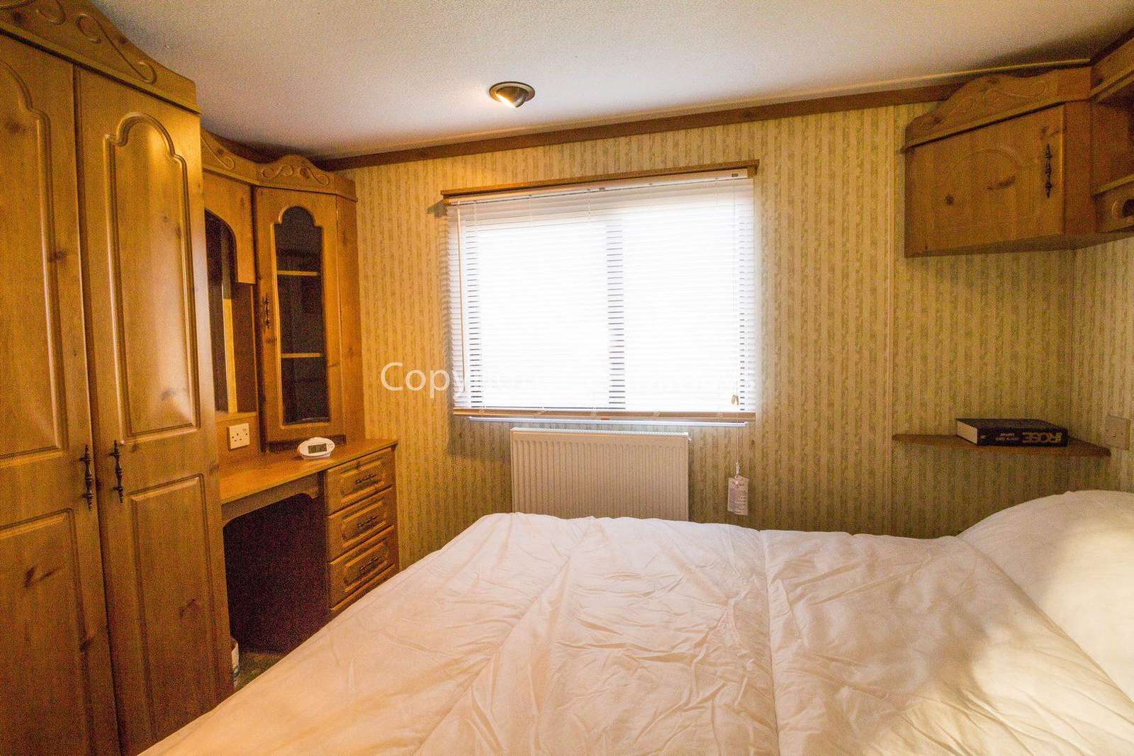 You can find plenty of storage in this master bedroom!