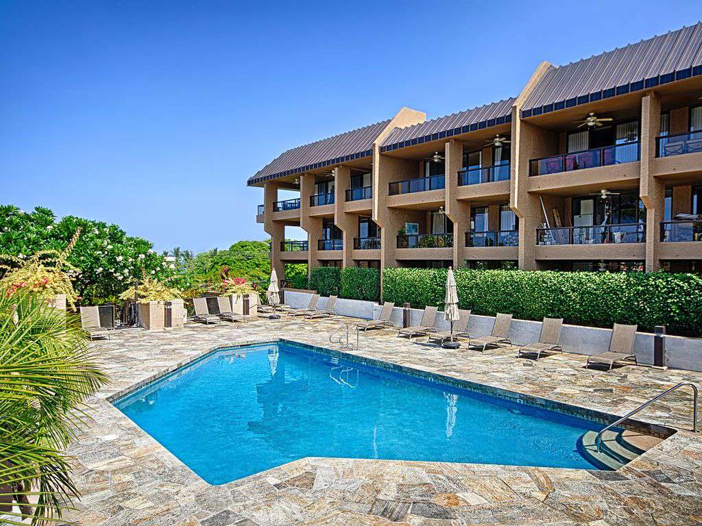 Beautiful pool with sundeck that has an ocean view. BBQ grills here.