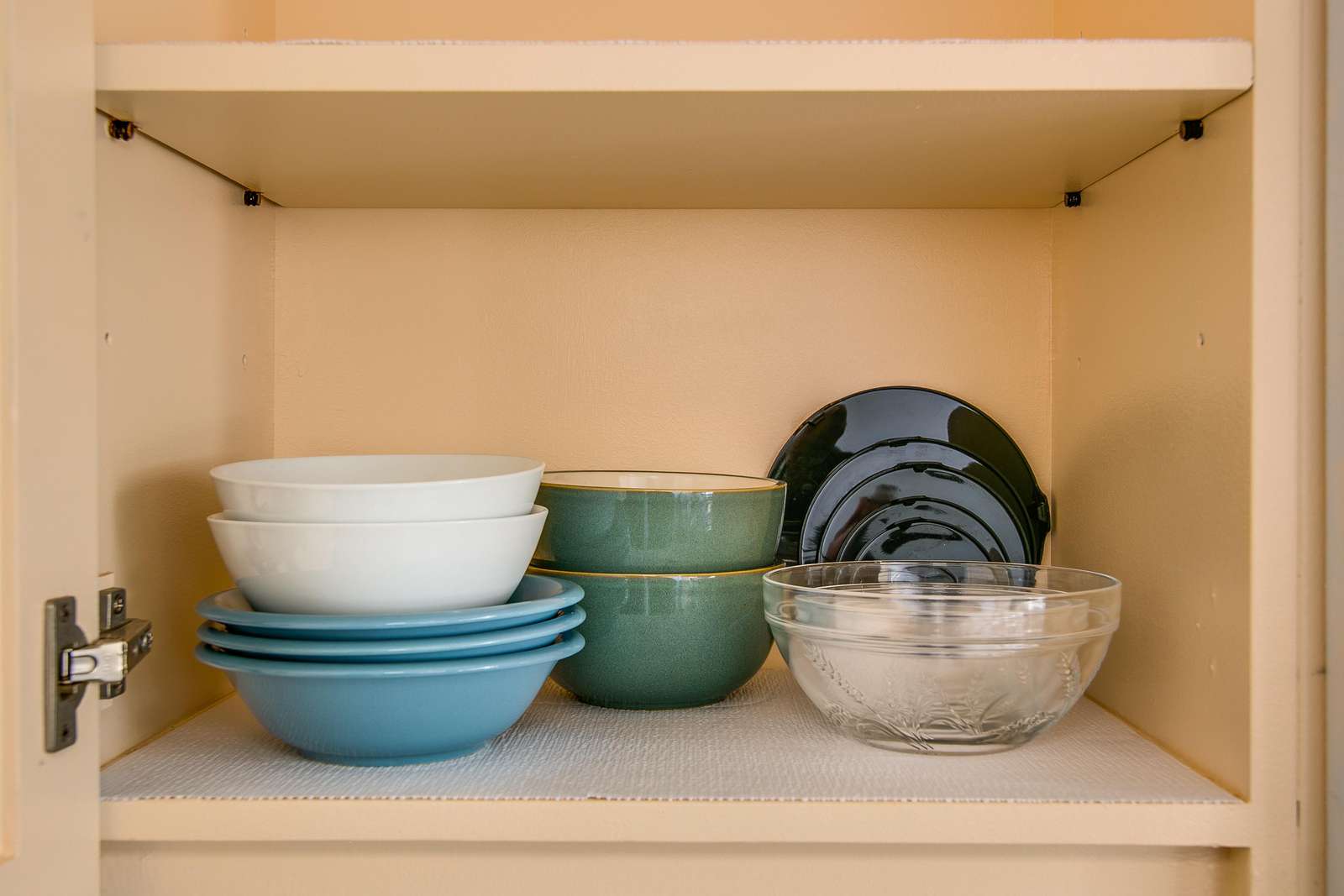 Plenty of dishes in the various cupboards