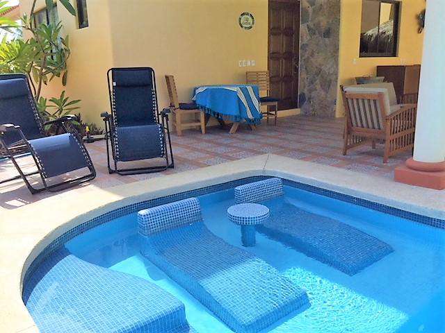 In-pool loungers & plenty of seating on the patio