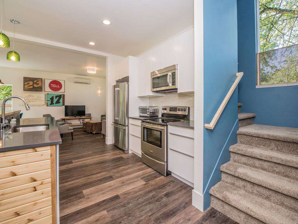 Stairs going to the upper level- 4 bedrooms, 2 bathrooms, a den and balcony!
