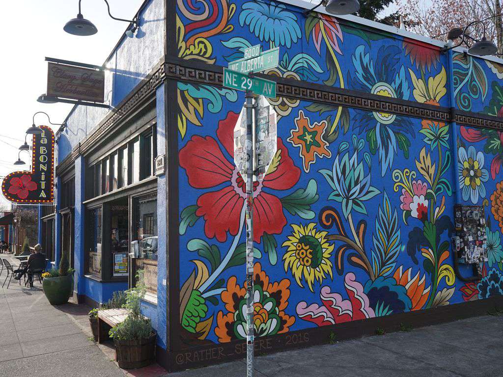 Colorful inspiring murals and public art line NE Alberta Arts District.