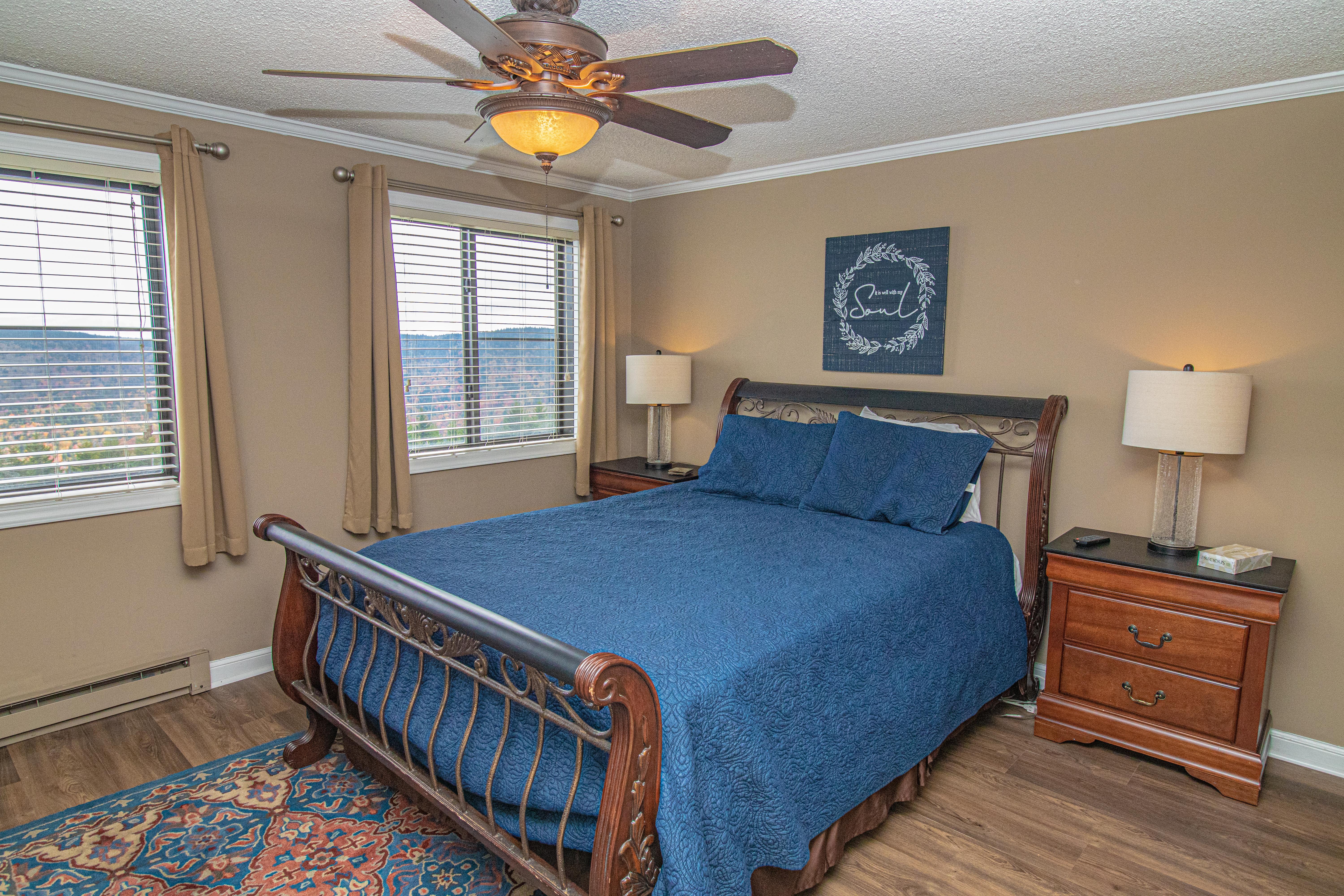 Queen-sized bed in master bedroom. Located on mountain side - NOT the hallway side of bldg!
